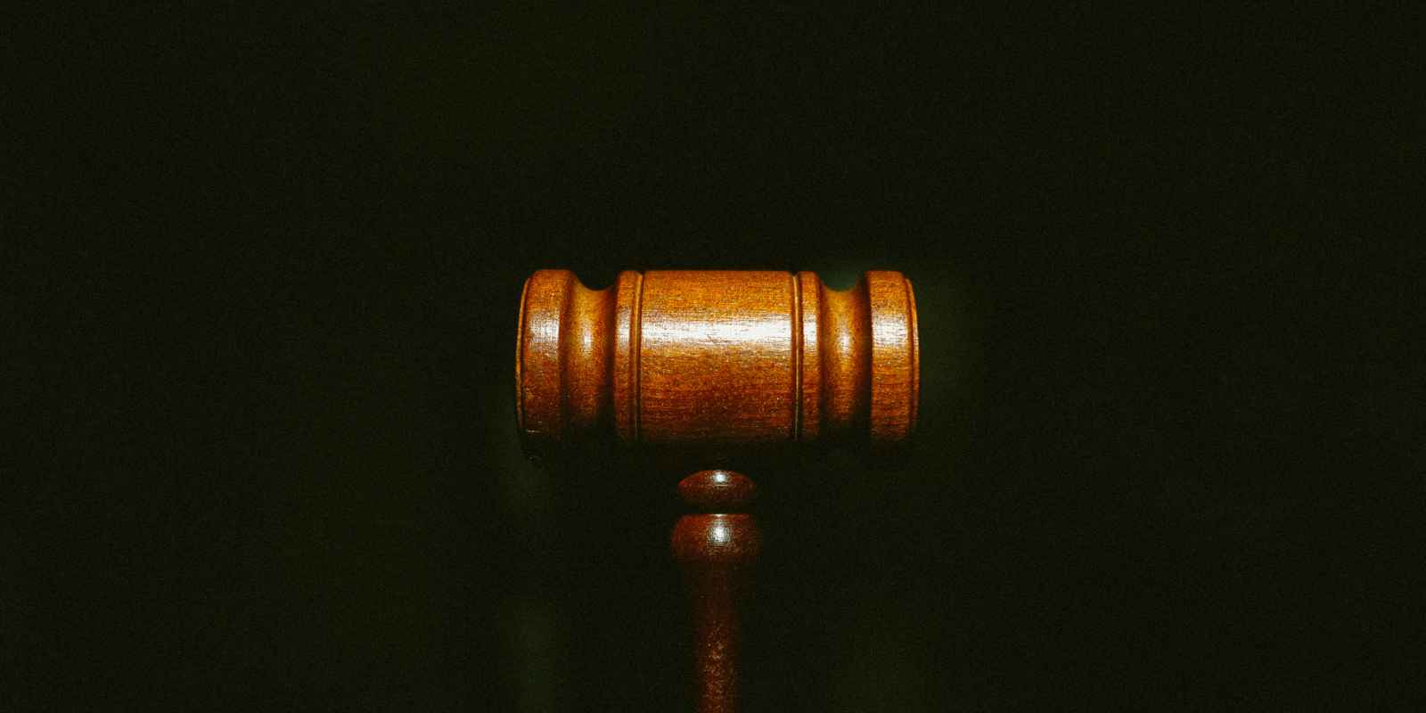 Photo of a gavel in front of a black background