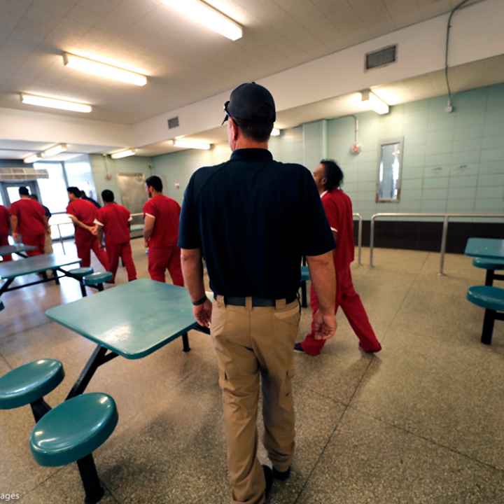 Immigration detainees leave the cafeteria under the watch of guards during a media tour at the Winn Correctional Center in Winnfield, La., in this Thursday, Sept. 26, 2019 file photo.